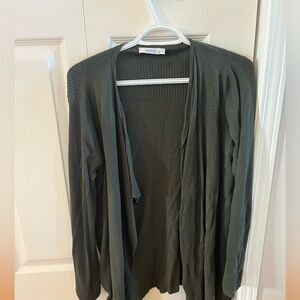 Ricki’s dark green cardigan
